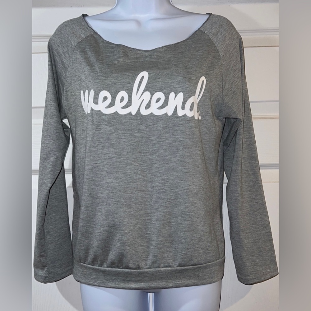 Light gray off the shoulder long sleeve shirt with “weekend “ on it